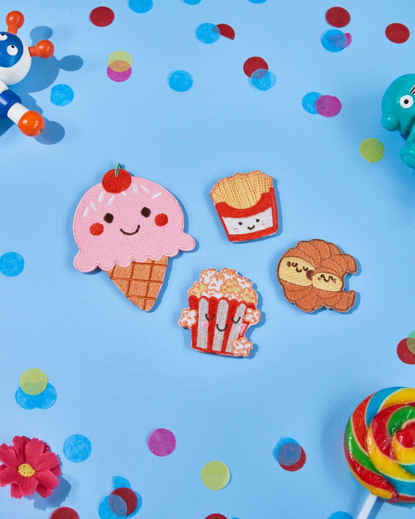 Patchel Popcorn Pals patch pack displayed on a colourful background with food-themed patches