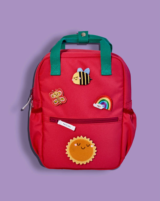 Watermelon Pink Patchel kids' backpack with swappable hook and loop patches in bee, butterfly, rainbow and sun