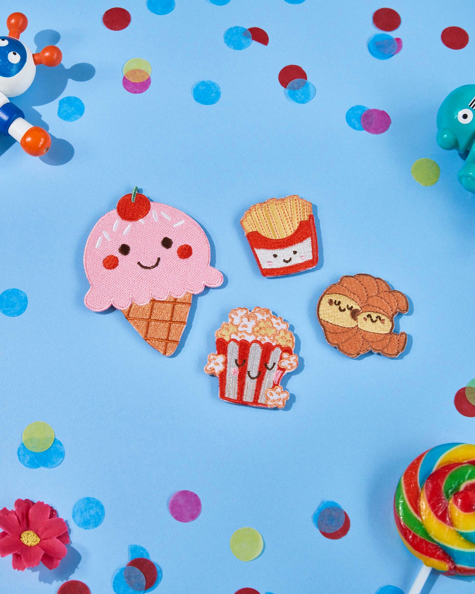 Patchel Popcorn Pals patch pack displayed on a colourful background with food-themed patches