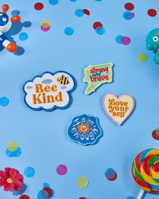 Patchel Positivity patch pack displayed on a colourful background with uplifting message patches