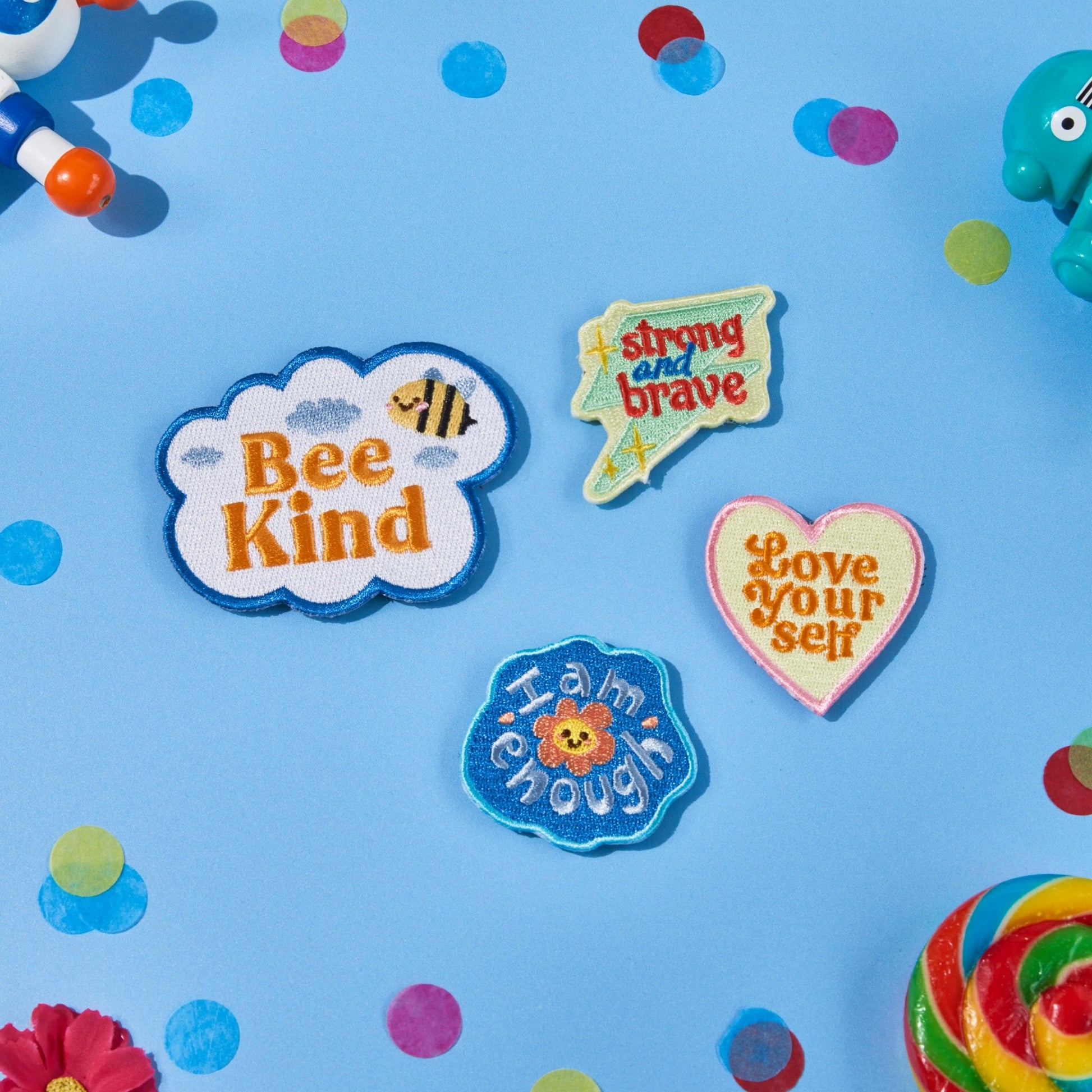 Positivity swappable backpack patch pack featuring Love Yourself, I Am Enough, Bee Kind and Strong and Brave designs