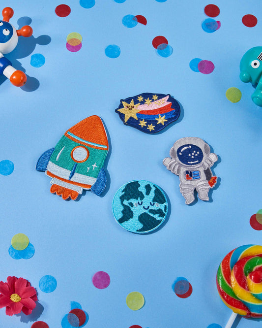 Patchel Space Explorers patch pack displayed on a colourful background with space-themed patches