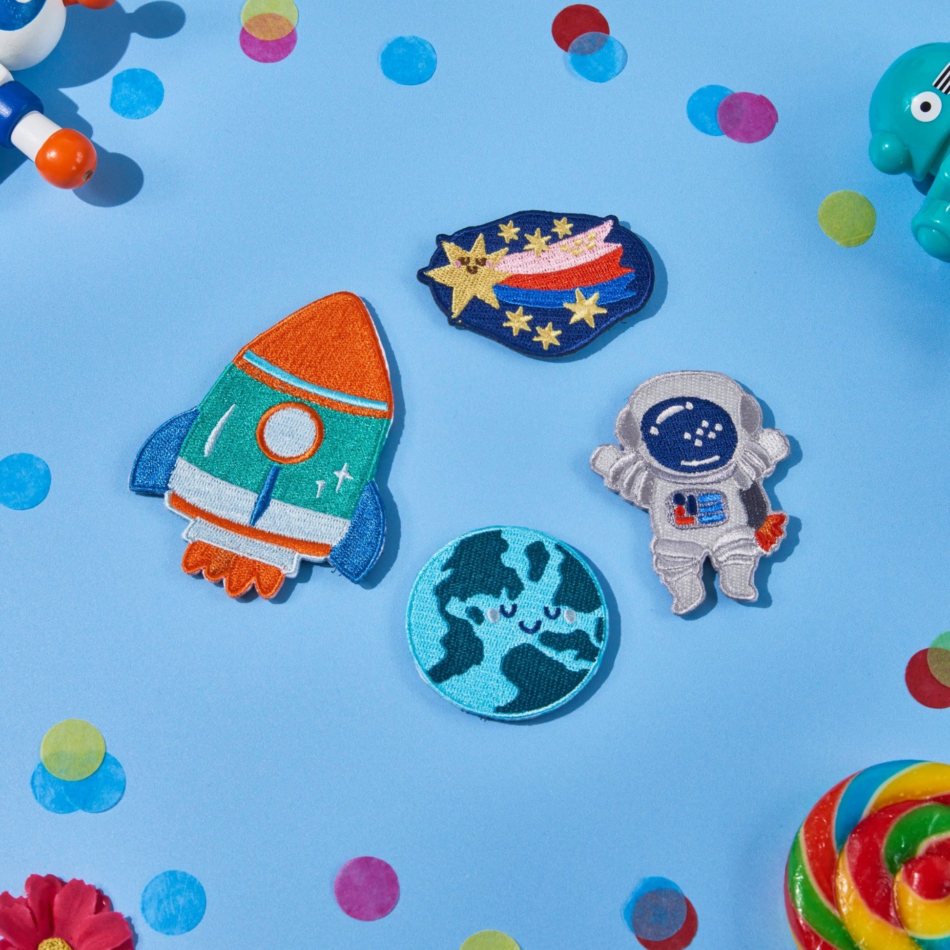 Space Explorers swappable backpack patch pack featuring a rocket, astronaut, shooting star and Earth