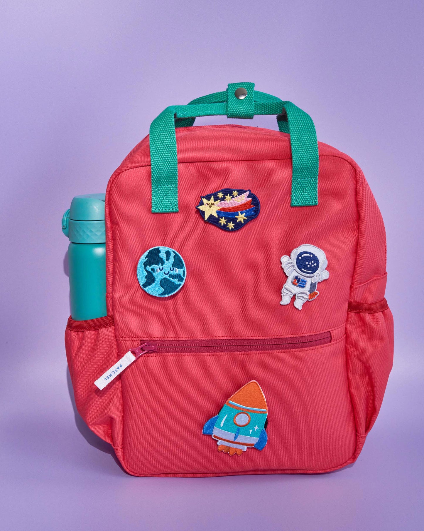Watermelon Pink Patchel children's backpack with Space Explorers patches featuring a rocket, astronaut, shooting star and Earth