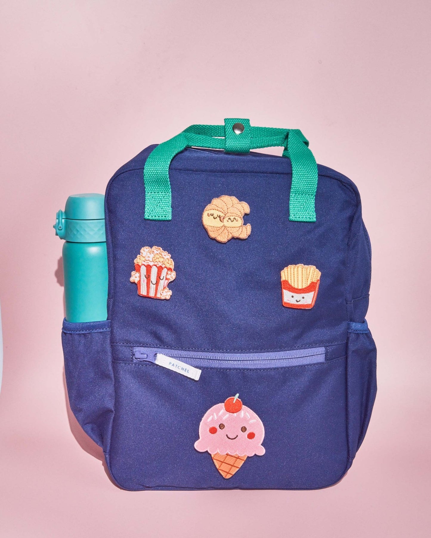 Midnight Blue school backpack with Popcorn Pals swappable patches featuring popcorn, ice cream, fries and a croissant