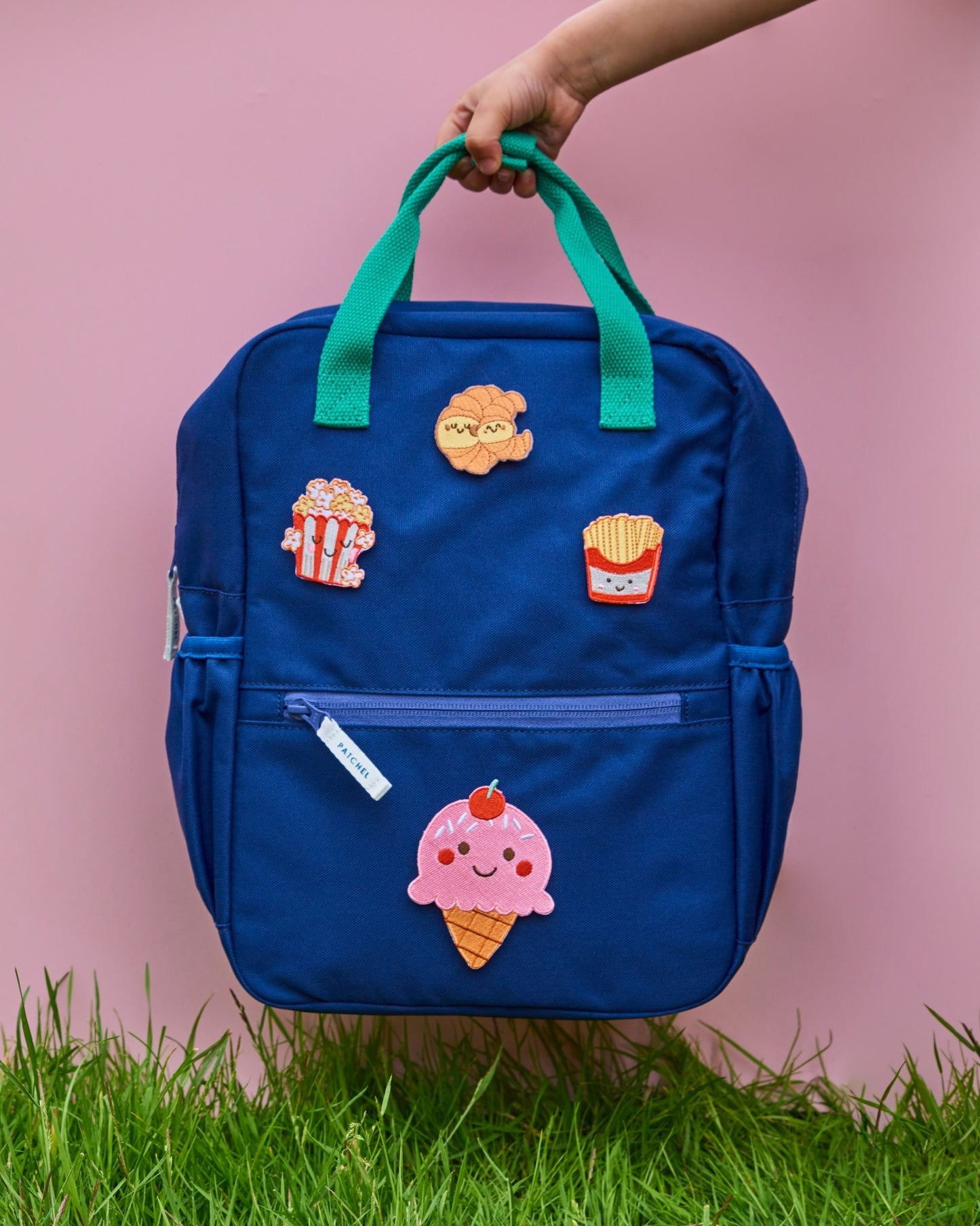 Midnight Blue Patchel customisable children's backpack with Popcorn Pals patches featuring an ice cream, popcorn, fries and croissant